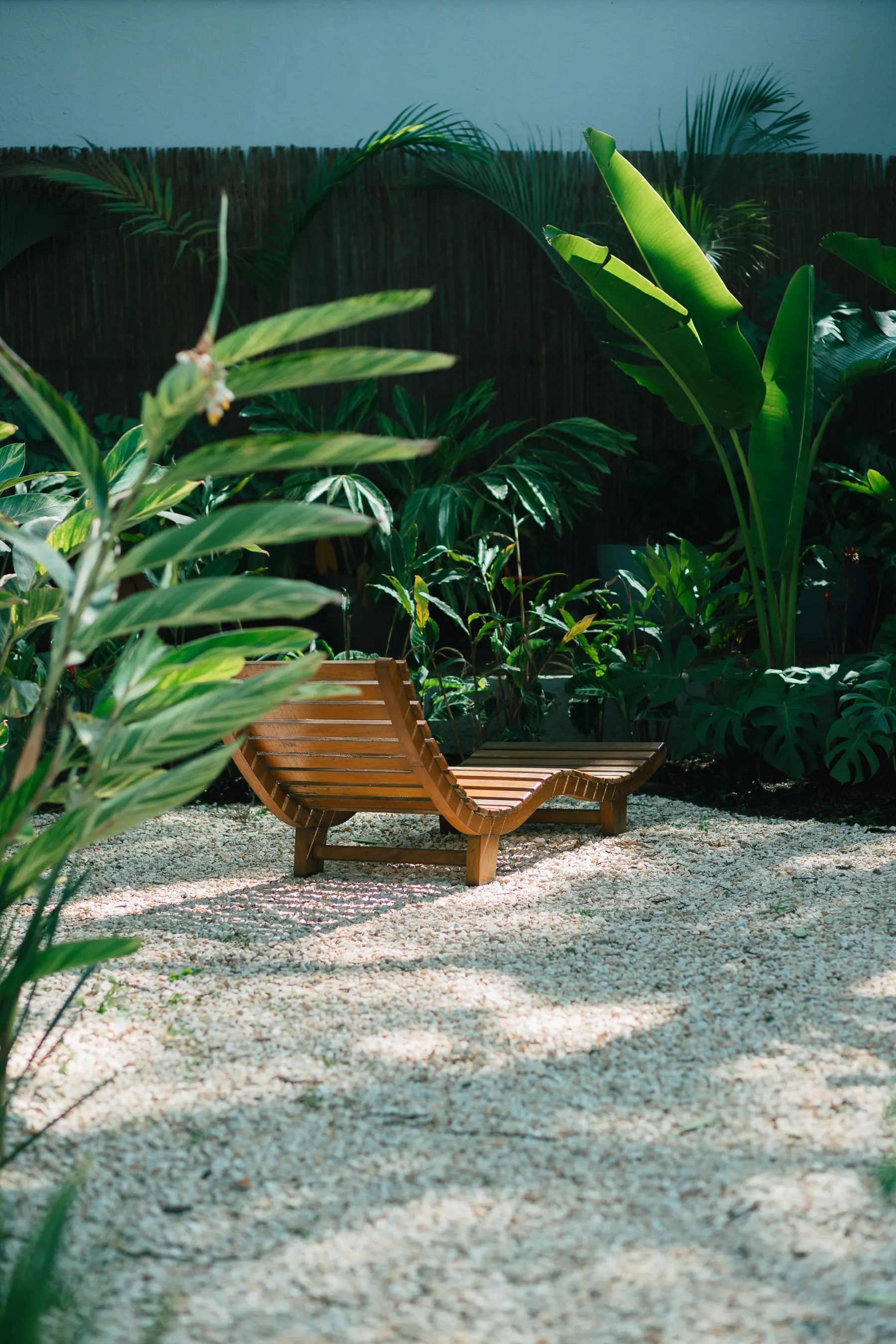 A quiet tropical space where natural materials and landscape set the mood