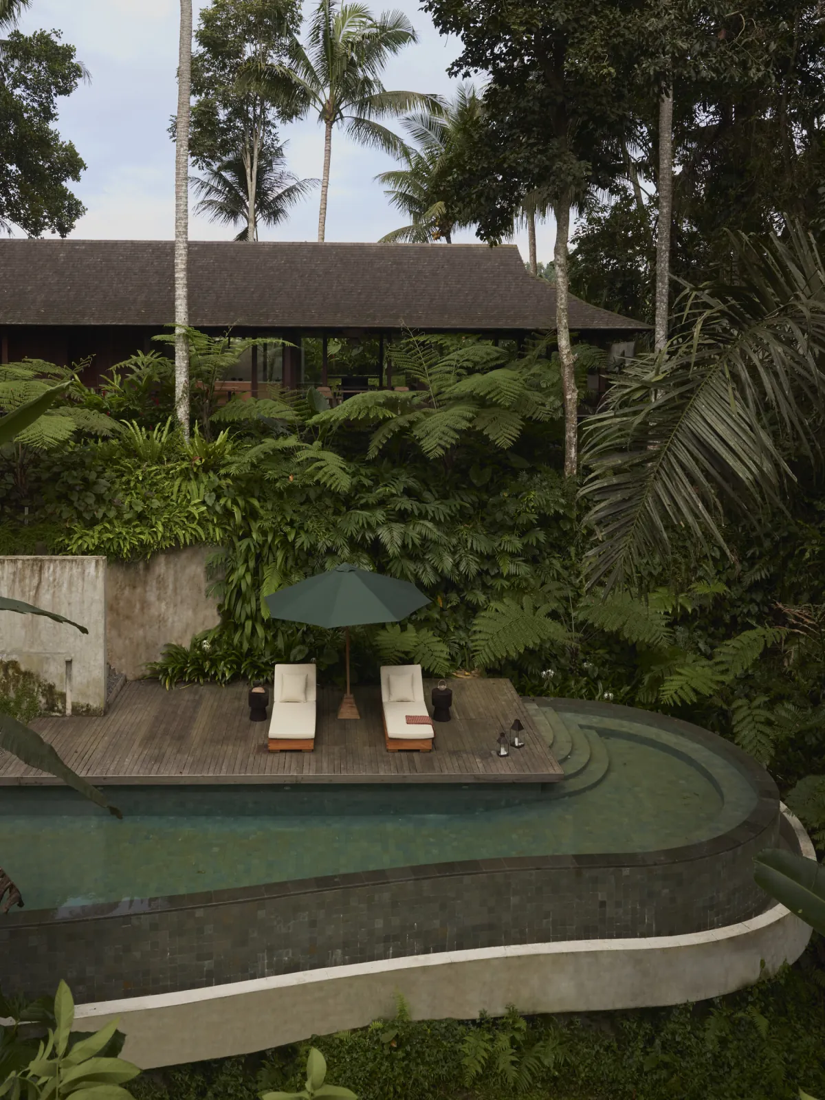 Exterior of Rumah Haruku by Bada Studio within mature tropical vegetation in Pejeng, Bali