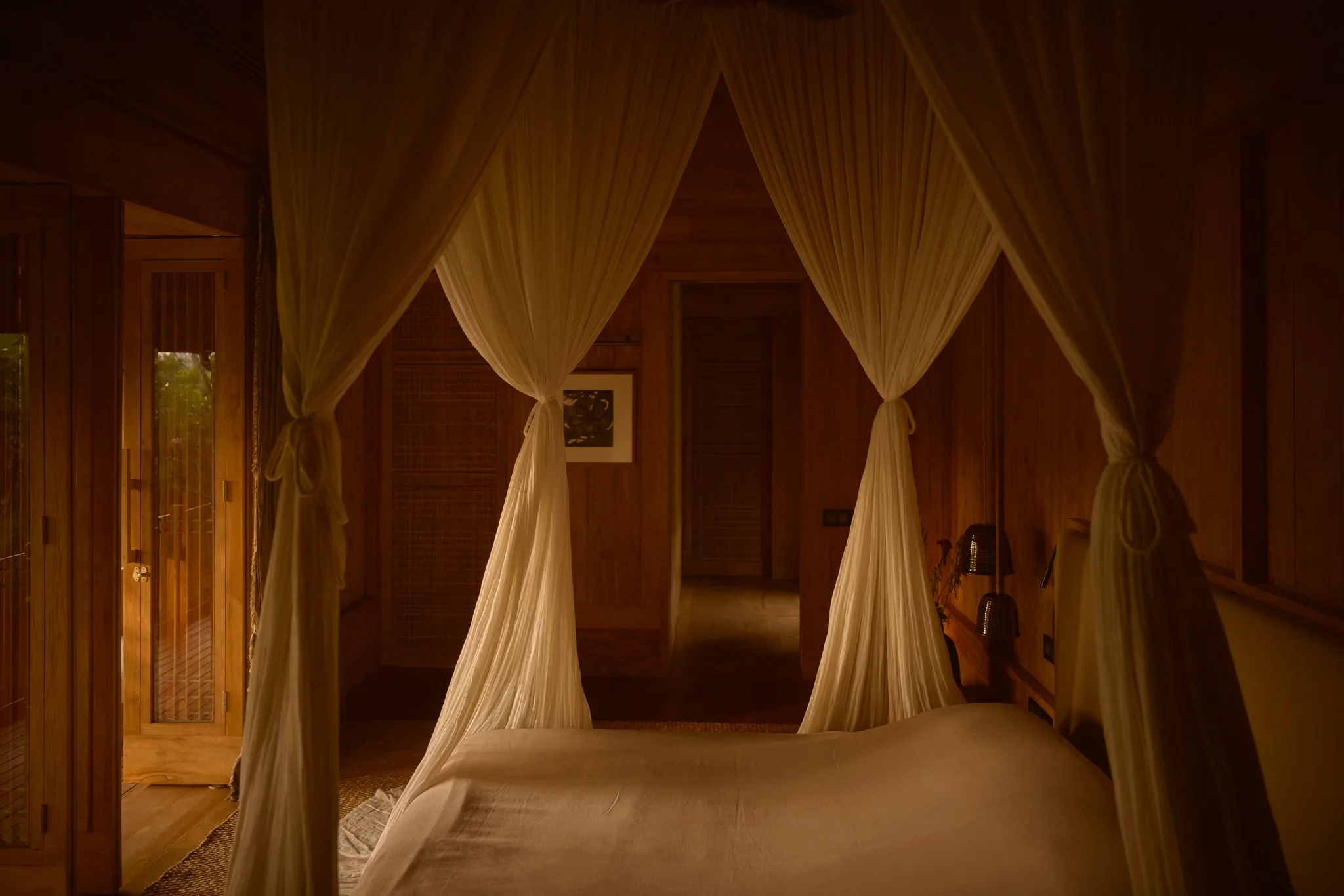 Open-air teak living spaces at Rumah Rubah facing the garden