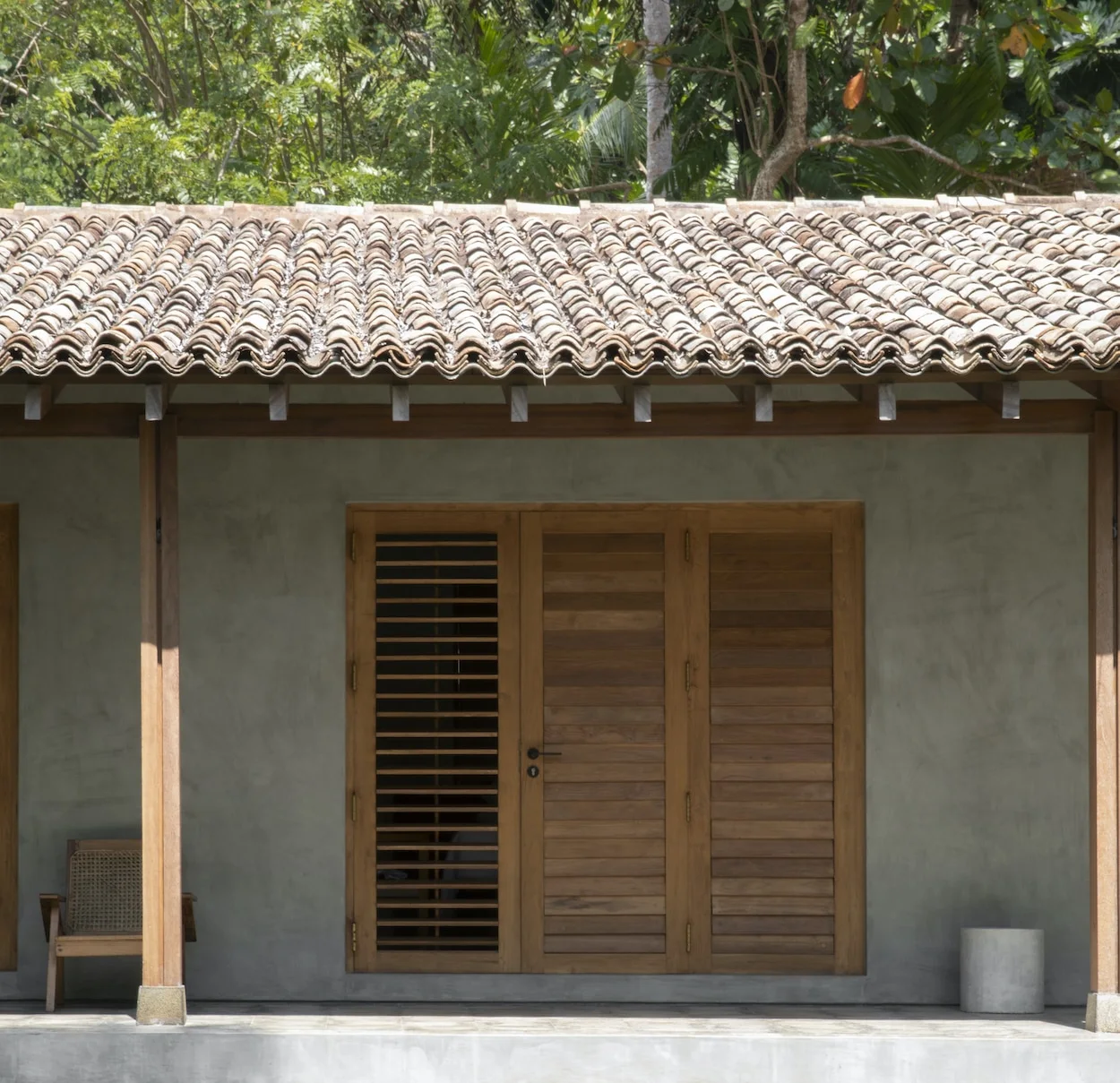 Shaded verandah in a tropical house creating a transition between interior and landscape