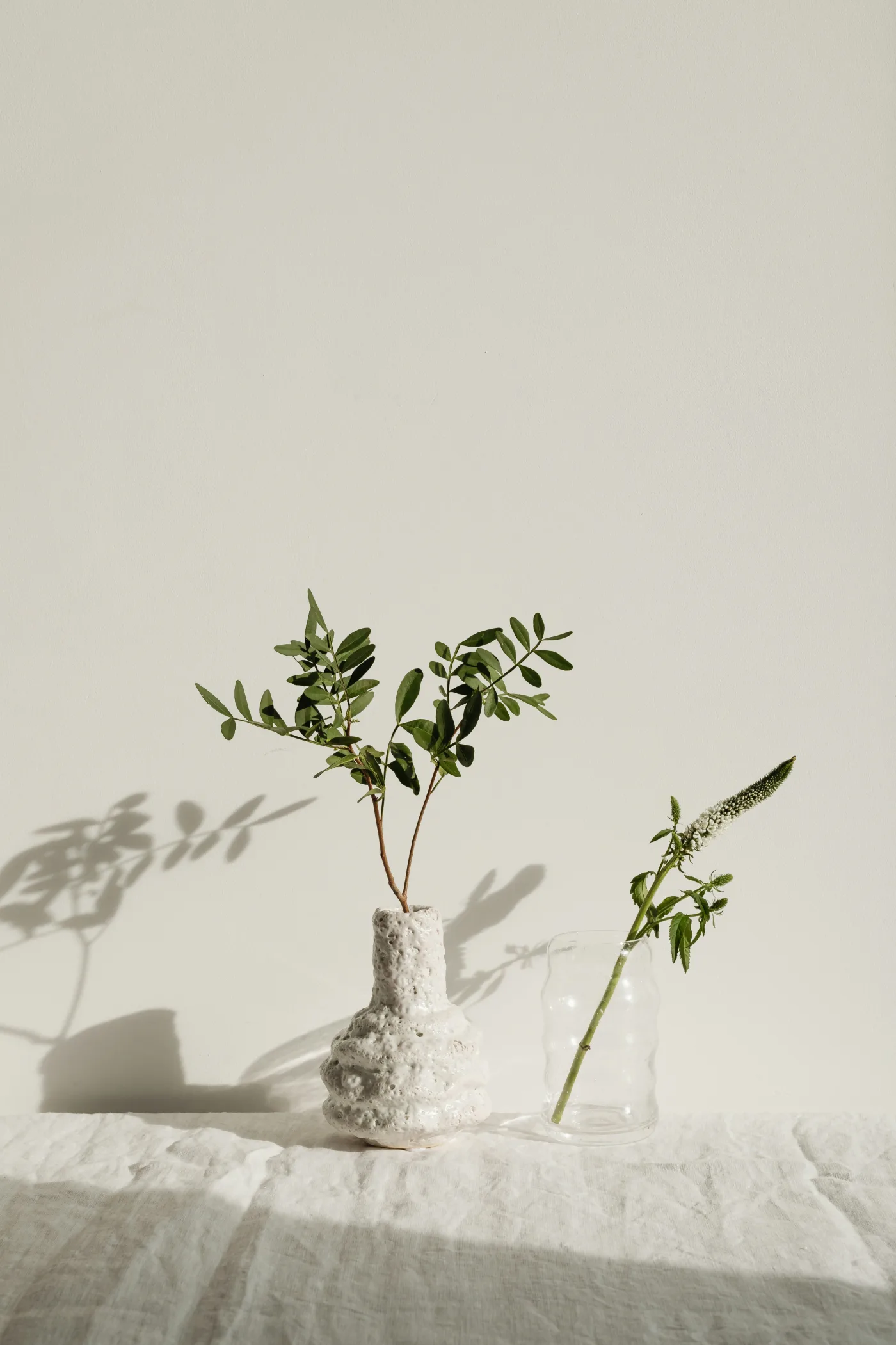Large tropical garden cuttings styled in a vessel inside a minimal home