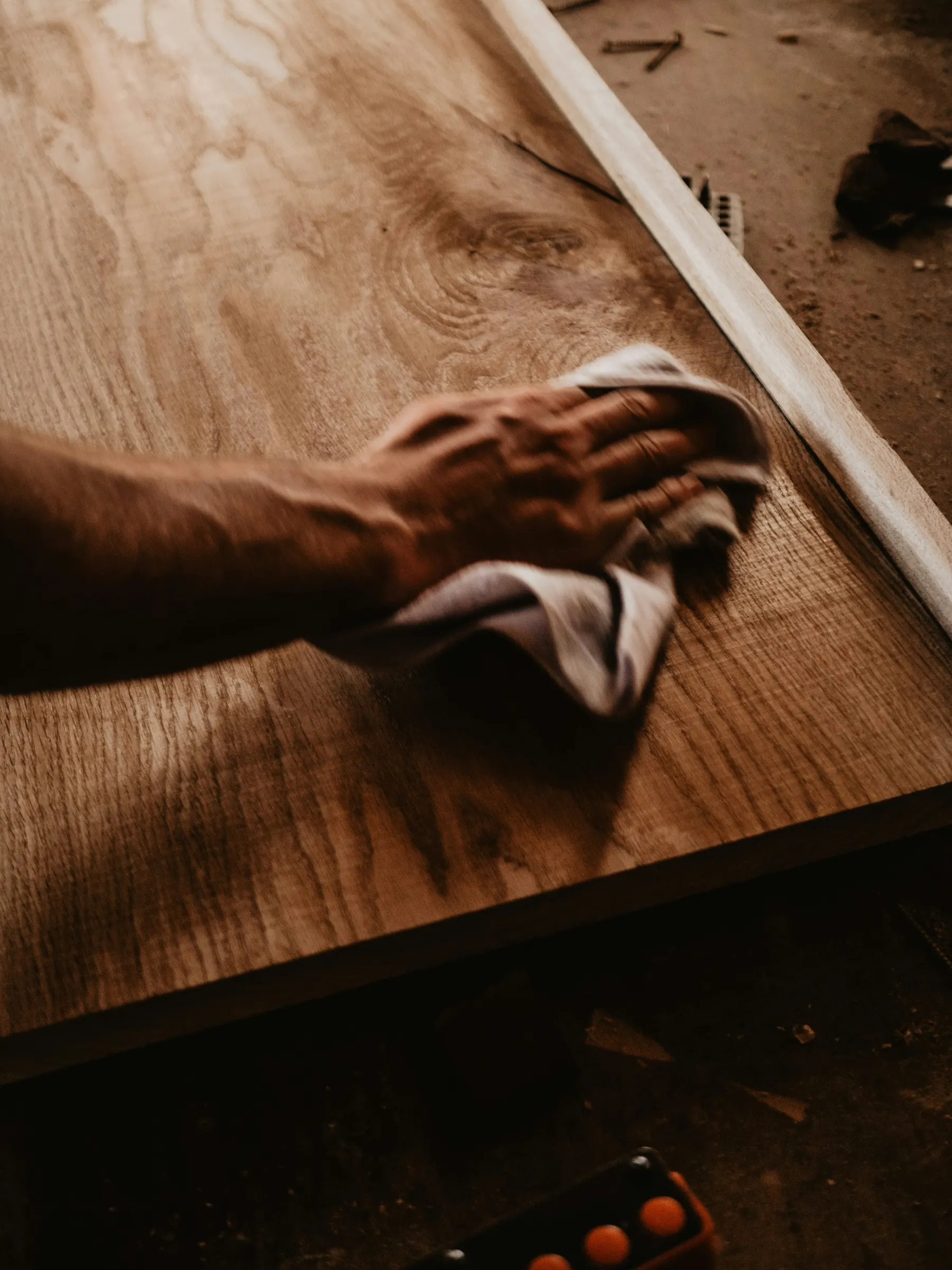 Teak wood being finished by hand for tropical interiors
